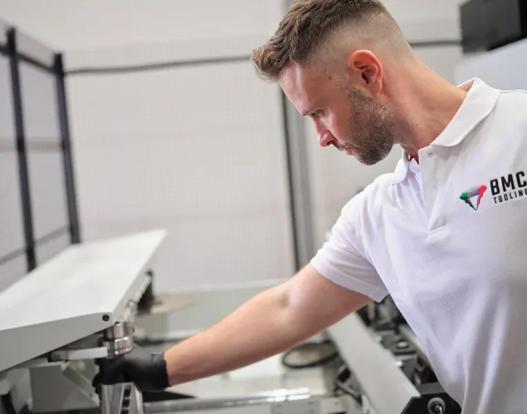 BMC Tooling technician fitting a cutter head to a machine